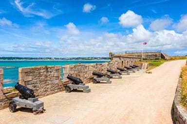 The historic cannons at Elizabeth Castle off the coast of St. Helier in Jersey.