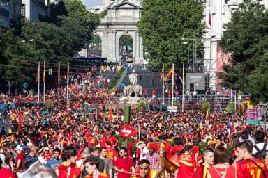 Excited Spanish fans celebrate in the Plaza de Cibeles in the victory of the Spanish football team.