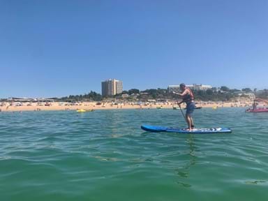 Niel paddleboarding along the sunny shores of the Algarve.