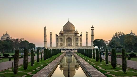 Catch the sunrise at the Taj Mahal